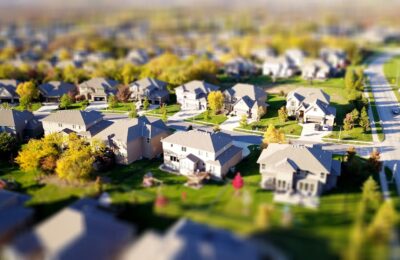 Clean, Modern Suburban Street With A Row Of Similar, Well-maintained Houses Under A Clear Sky, Illustrating A Competitive ...