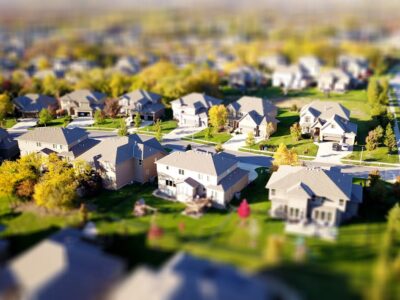 Clean, Modern Suburban Street With A Row Of Similar, Well-maintained Houses Under A Clear Sky, Illustrating A Competitive ...